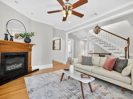 a living room with furniture and a fireplace