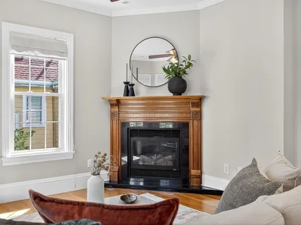 a living room with furniture and a fireplace
