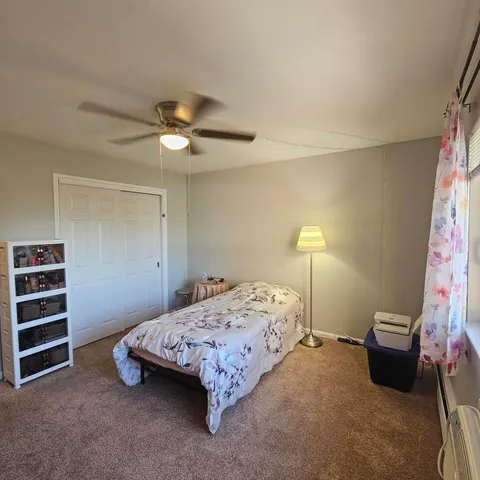 a bedroom with a bed and furniture