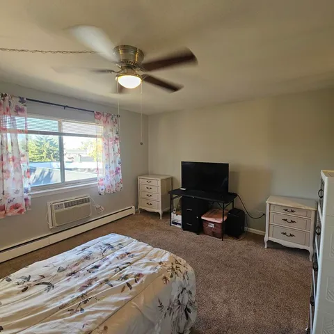a view of a bathroom from a corridor