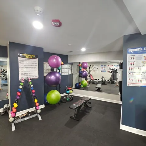 a living room with furniture and view of kitchen