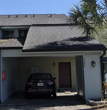 a car parked in front of a house