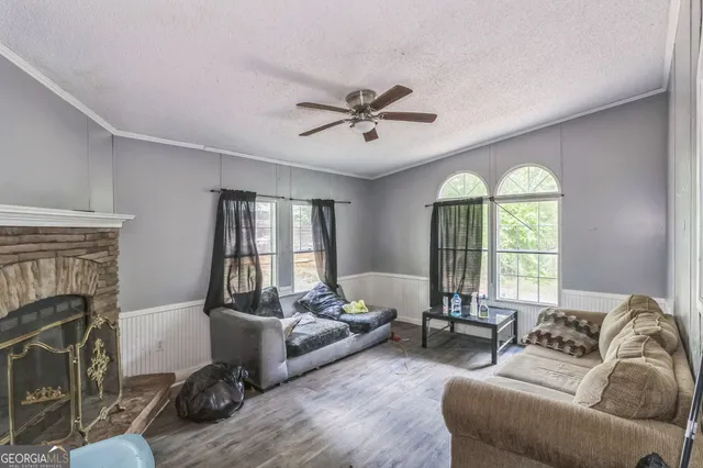 a living room with furniture and a fireplace
