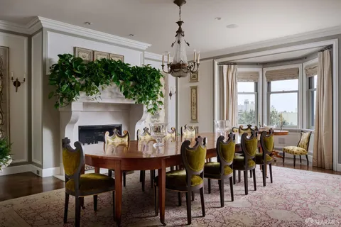 a kitchen with stainless steel appliances a stove a sink and a refrigerator