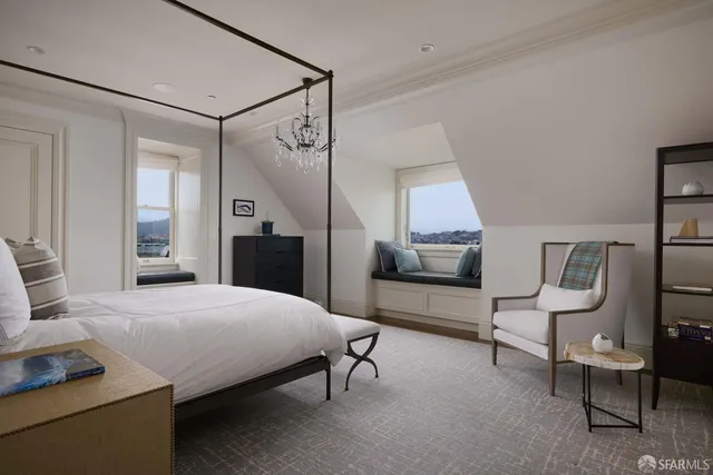 a living room with furniture a flat screen tv and a large window