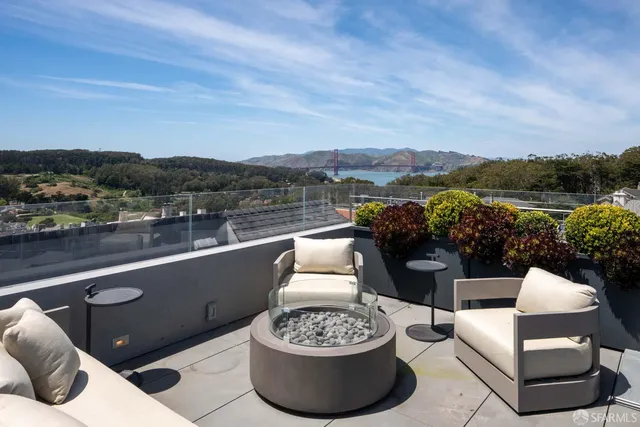 a view of livingroom with furniture and a fireplace