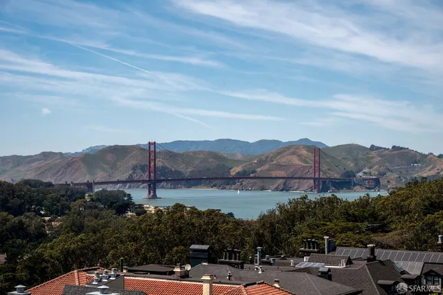 a front view of a house with potted plants