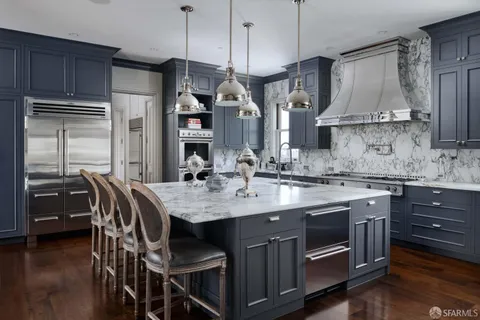 a living room with furniture cabinets and a flat screen tv