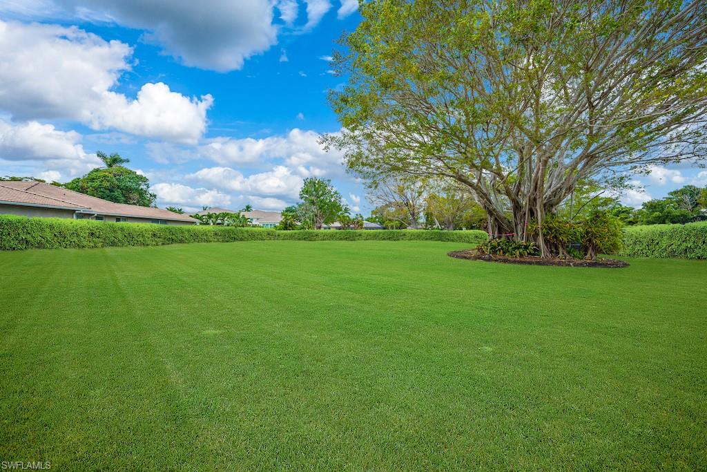 3215 Regatta Road Naples, FL 34103 - Photo 2 of 9 a view of a field with plants and trees