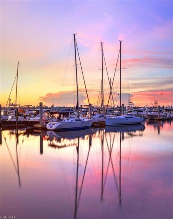 3215 Regatta Road Naples, FL 34103 - Photo 6 of 9 a view of lake with boats and trees in the background