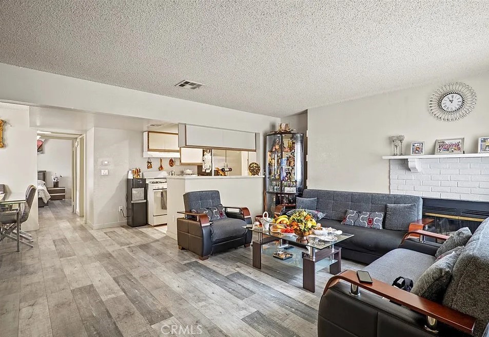 10219 Commerce Tujunga, CA 91042 - Photo 6 of 12 a living room with furniture cabinets and a window