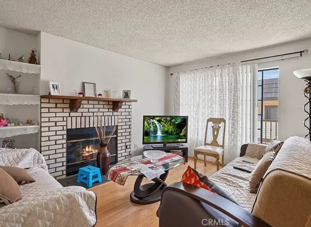 a living room with furniture fireplace and a flat screen tv