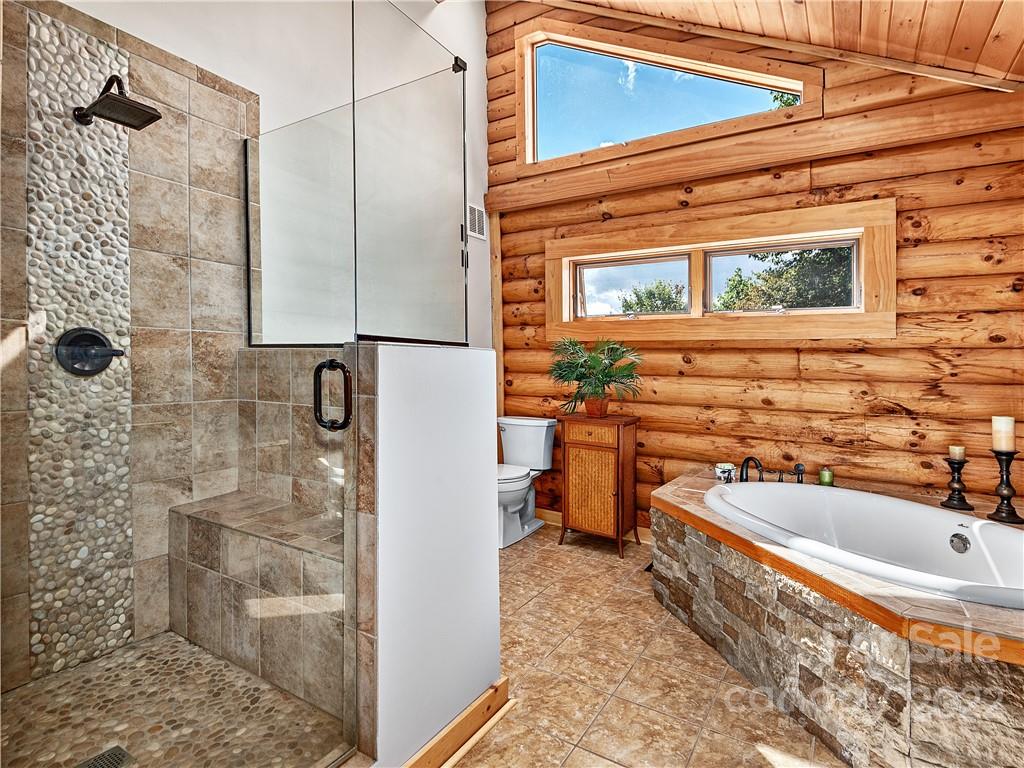 866 Pine Tree Road Spruce Pine, NC 28777 - Photo 13 of 38 a bathroom with a sink and a bathtub