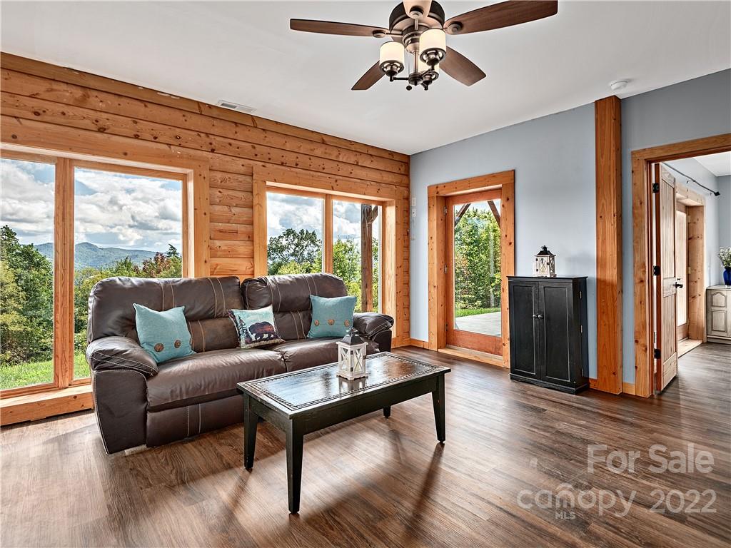 866 Pine Tree Road Spruce Pine, NC 28777 - Photo 16 of 38 a living room with furniture and wooden floor