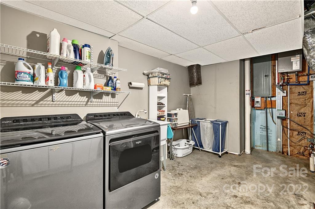 866 Pine Tree Road Spruce Pine, NC 28777 - Photo 23 of 38 a view of a storage & utility room with washer and dryer