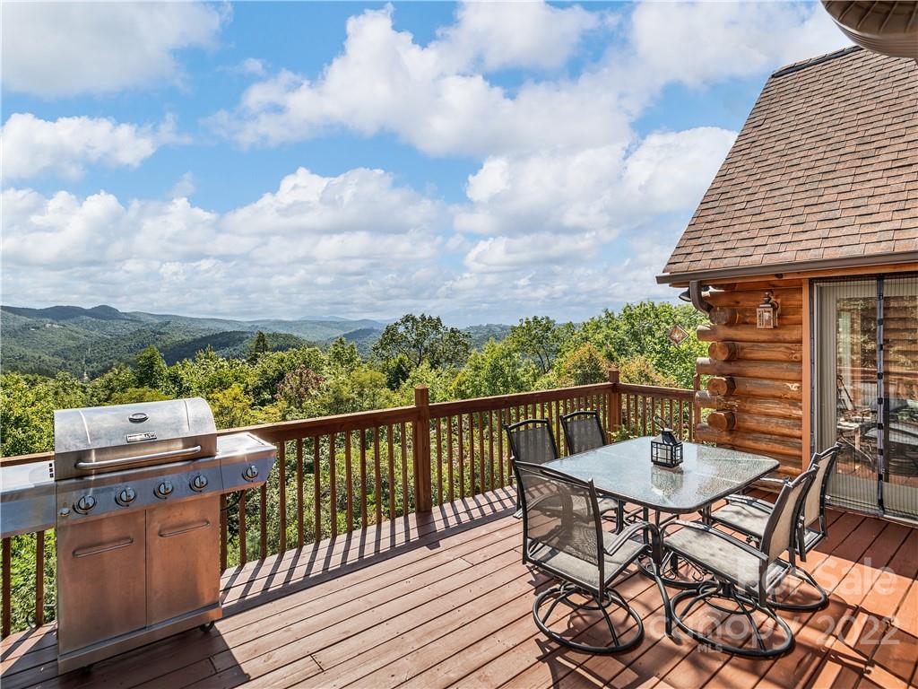 866 Pine Tree Road Spruce Pine, NC 28777 - Photo 26 of 38 a view of a table and chairs on the roof deck