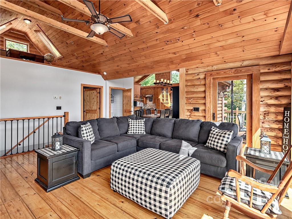866 Pine Tree Road Spruce Pine, NC 28777 - Photo 3 of 38 a living room with furniture and a large window