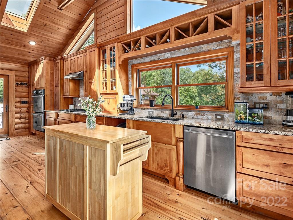 866 Pine Tree Road Spruce Pine, NC 28777 - Photo 7 of 38 a kitchen with a stove a sink and a refrigerator