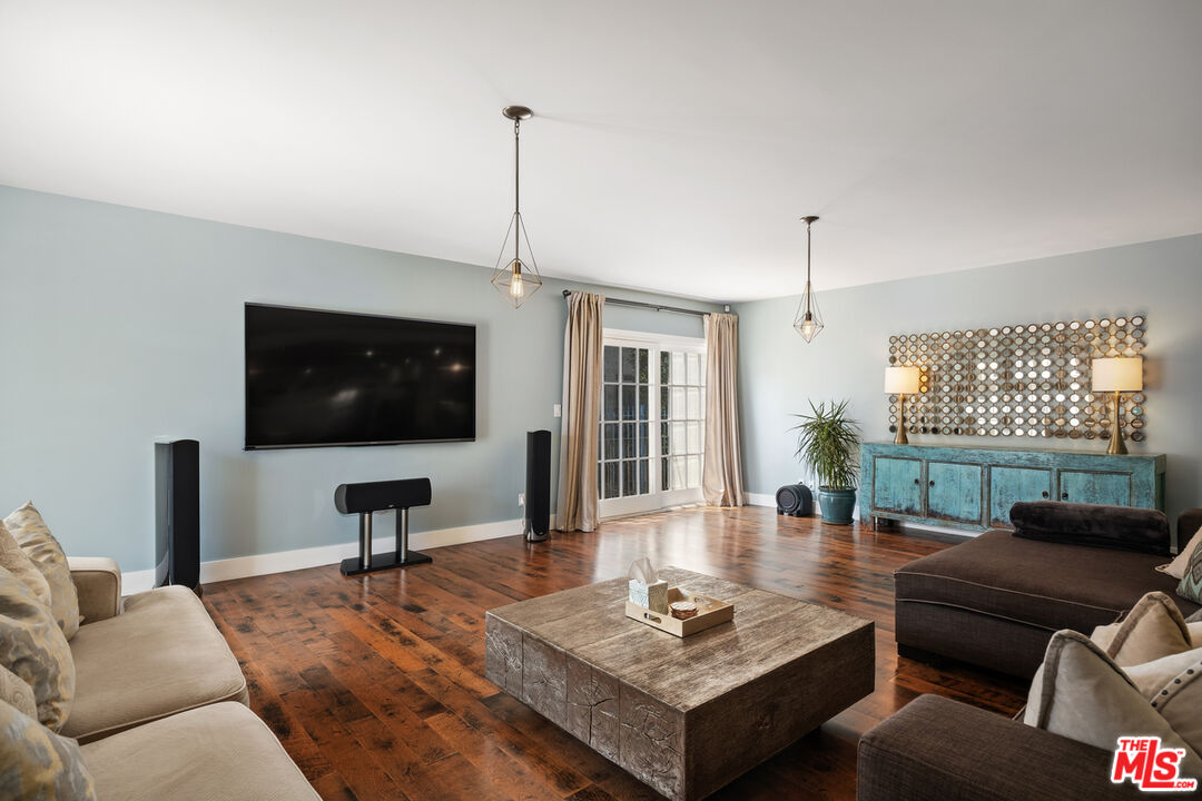 1632 Virginia Road Los Angeles, CA 90019 - Photo 11 of 26 a living room with furniture and a flat screen tv