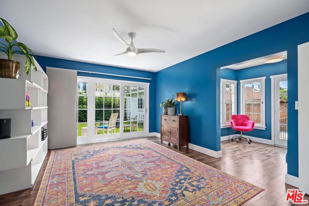 1632 Virginia Road Los Angeles, CA 90019 - Photo 12 of 26 a view of a bedroom with wooden floor and windows