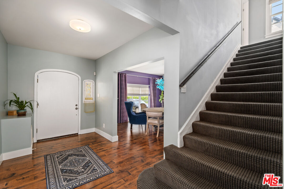 1632 Virginia Road Los Angeles, CA 90019 - Photo 4 of 26 a view of an entryway with wooden floor and a rug