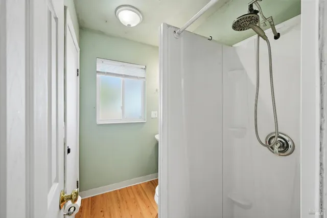 a view of a patio with table and chairs and potted plants