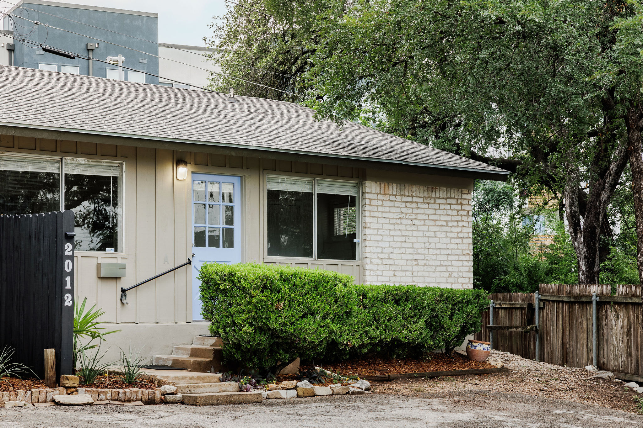 2012 Cody Court Austin, TX 78704 - Photo 2 of 40 A welcoming light blue door offers inviting entry to this charming residence with mature landscaping.