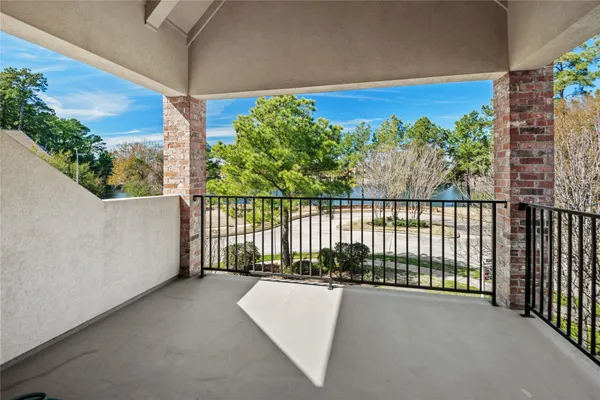 a view of balcony with furniture