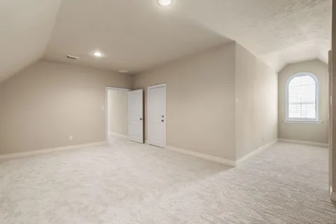 an aerial view of a house with a garden and swimming pool