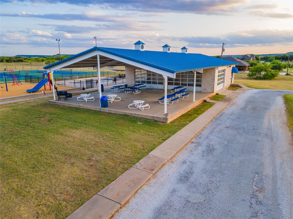 Lot 1 Pecan Cove Strawn, TX 76475 - Photo 14 of 25 a view of a house with a yard and sitting area