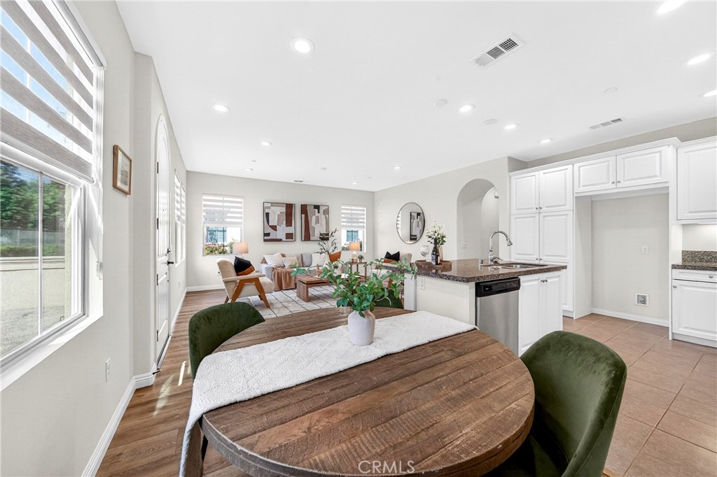 341 Adalina Lane Brea, CA 92821 - Photo 27 of 60 a view of a dining room with furniture window and wooden floor