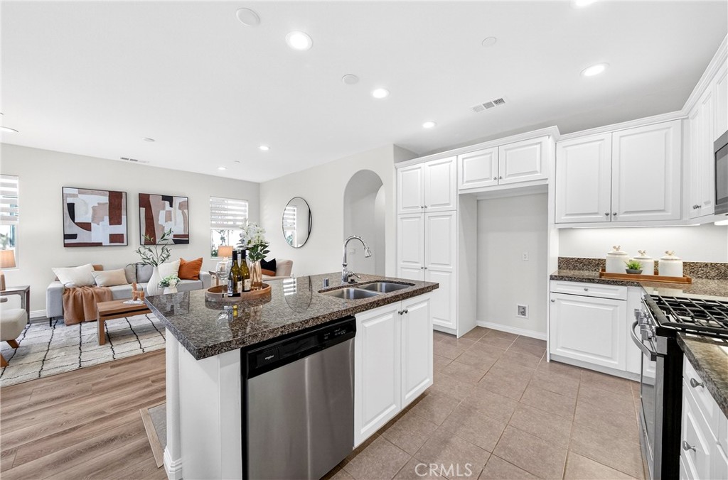 341 Adalina Lane Brea, CA 92821 - Photo 28 of 60 a kitchen with counter space appliances and a view of living room