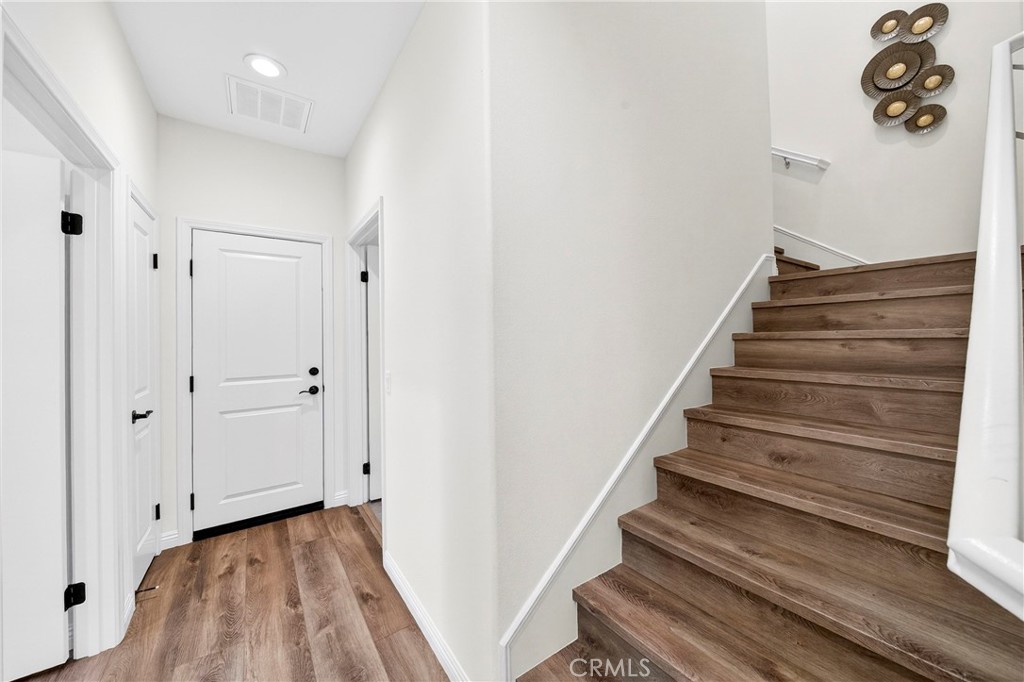 341 Adalina Lane Brea, CA 92821 - Photo 31 of 60 a view of a hallway with wooden floor and entryway