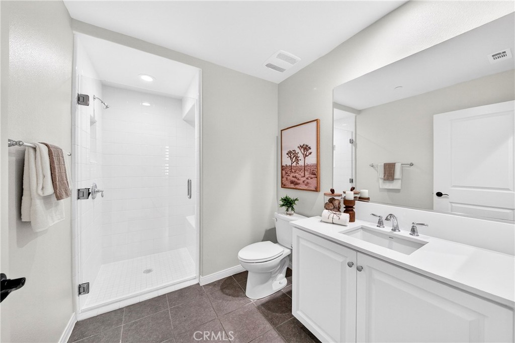 341 Adalina Lane Brea, CA 92821 - Photo 34 of 60 a bathroom with a double vanity sink toilet and shower