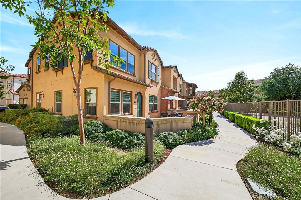 341 Adalina Lane Brea, CA 92821 - Photo 7 of 60 a view of a garden with a building in the background