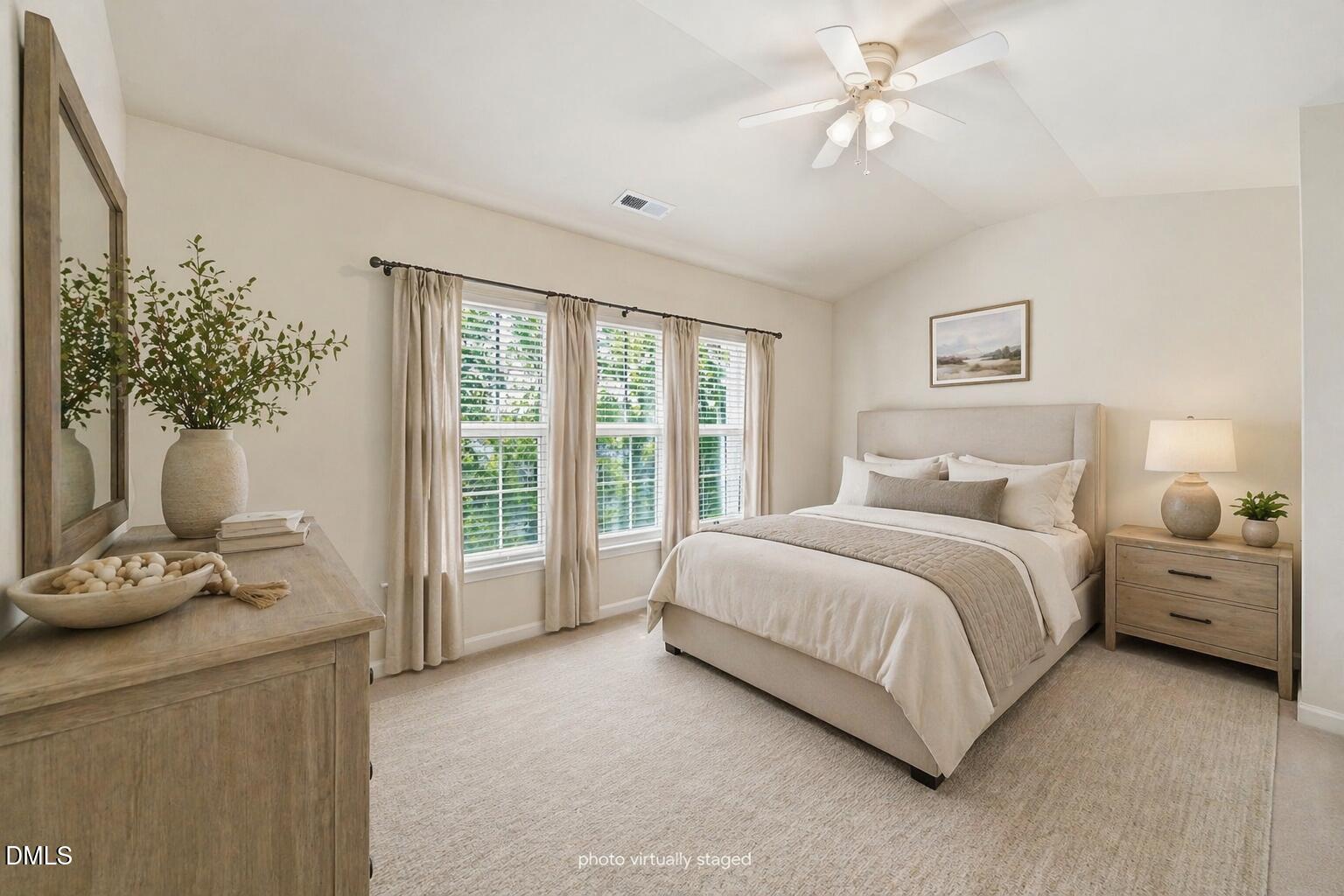 903 Straywhite Avenue Apex, NC 27539 - Photo 19 of 37 a spacious bedroom with a bed and a chandelier