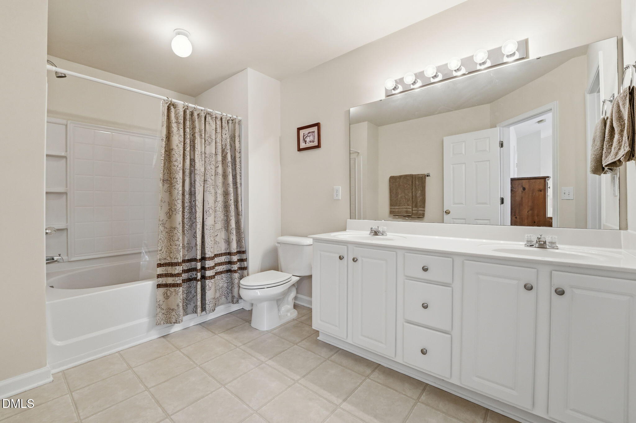 903 Straywhite Avenue Apex, NC 27539 - Photo 22 of 37 a bathroom with a double vanity sink toilet mirror and bathtub