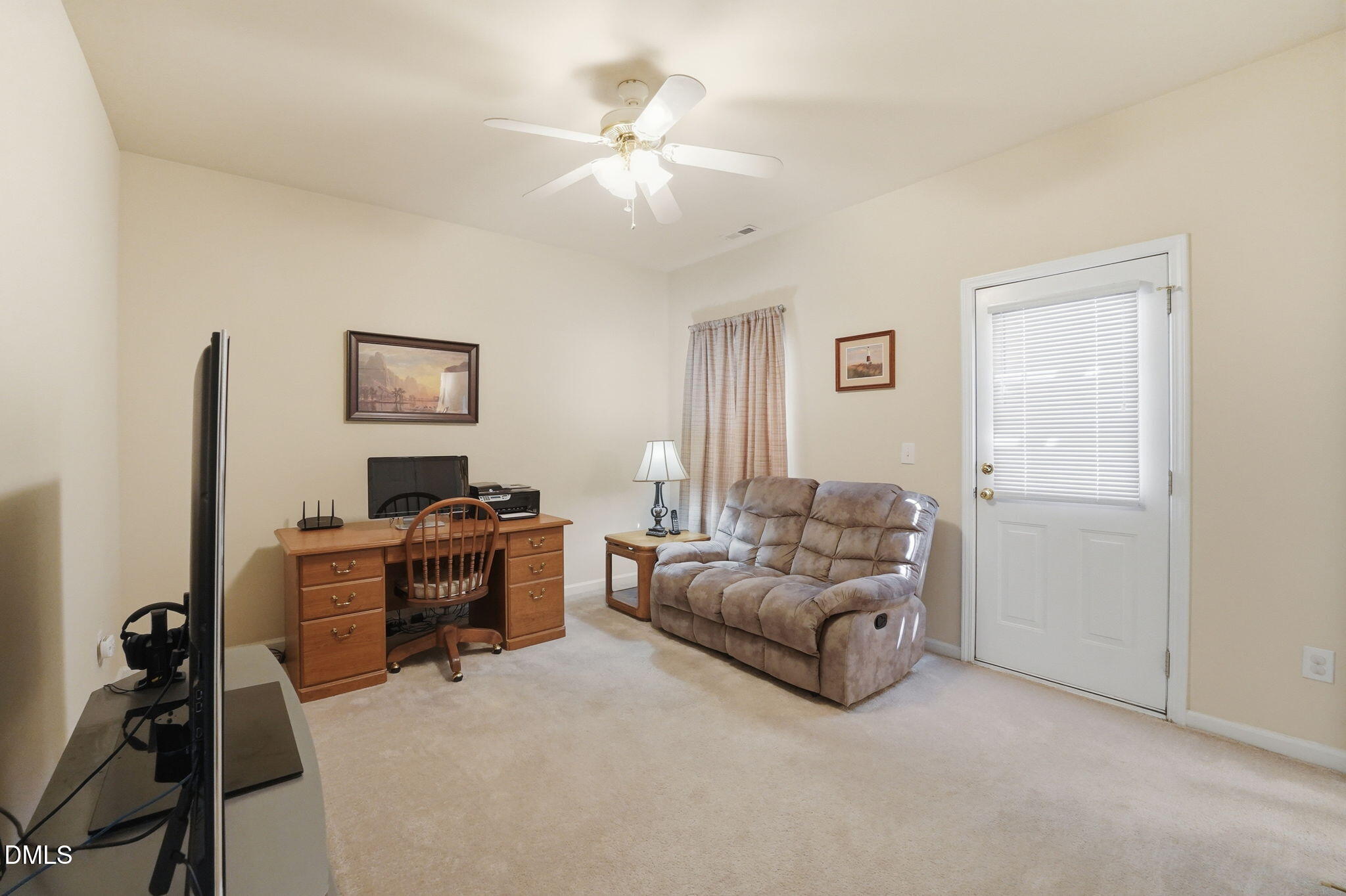 903 Straywhite Avenue Apex, NC 27539 - Photo 25 of 37 a living room with furniture and a flat screen tv