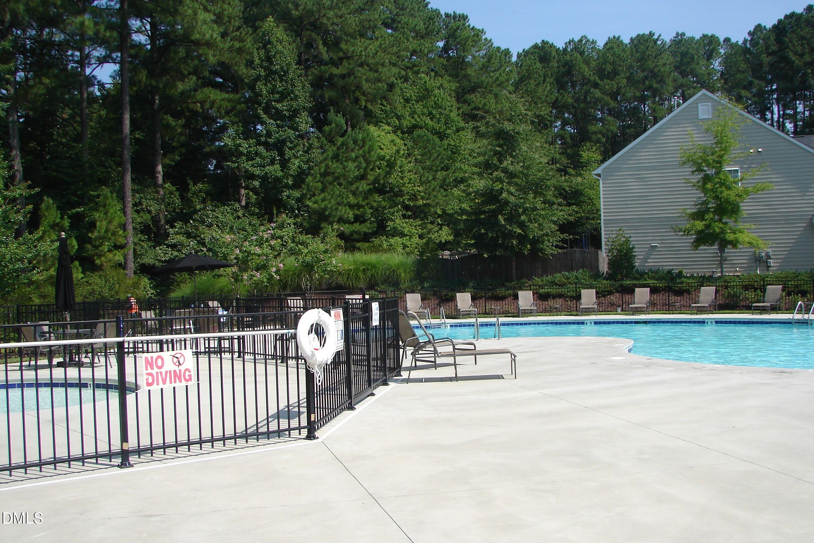 903 Straywhite Avenue Apex, NC 27539 - Photo 31 of 37 a view of a swimming pool with a patio and a yard