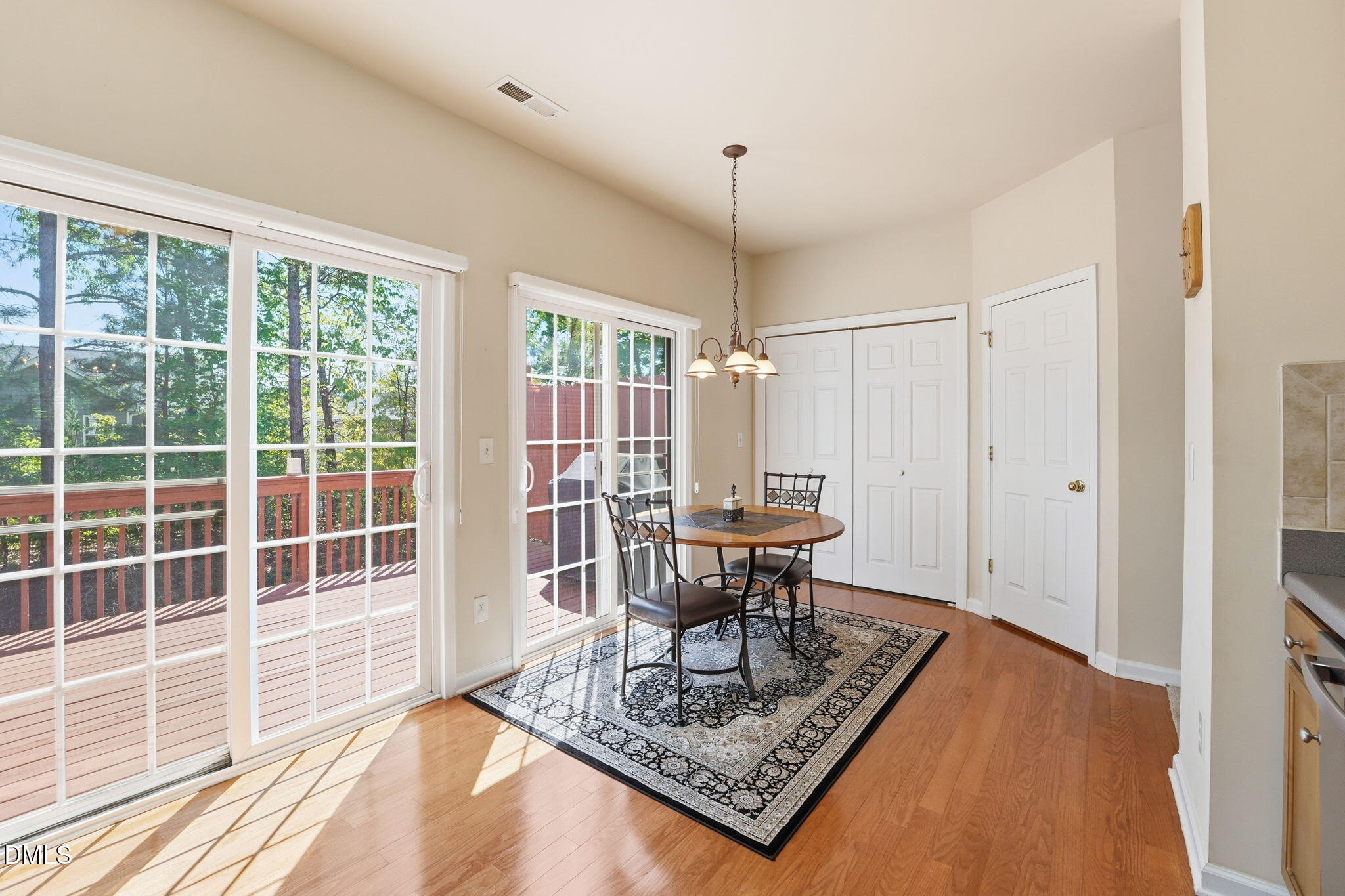 903 Straywhite Avenue Apex, NC 27539 - Photo 10 of 37 a view of a work space with furniture window and wooden floor