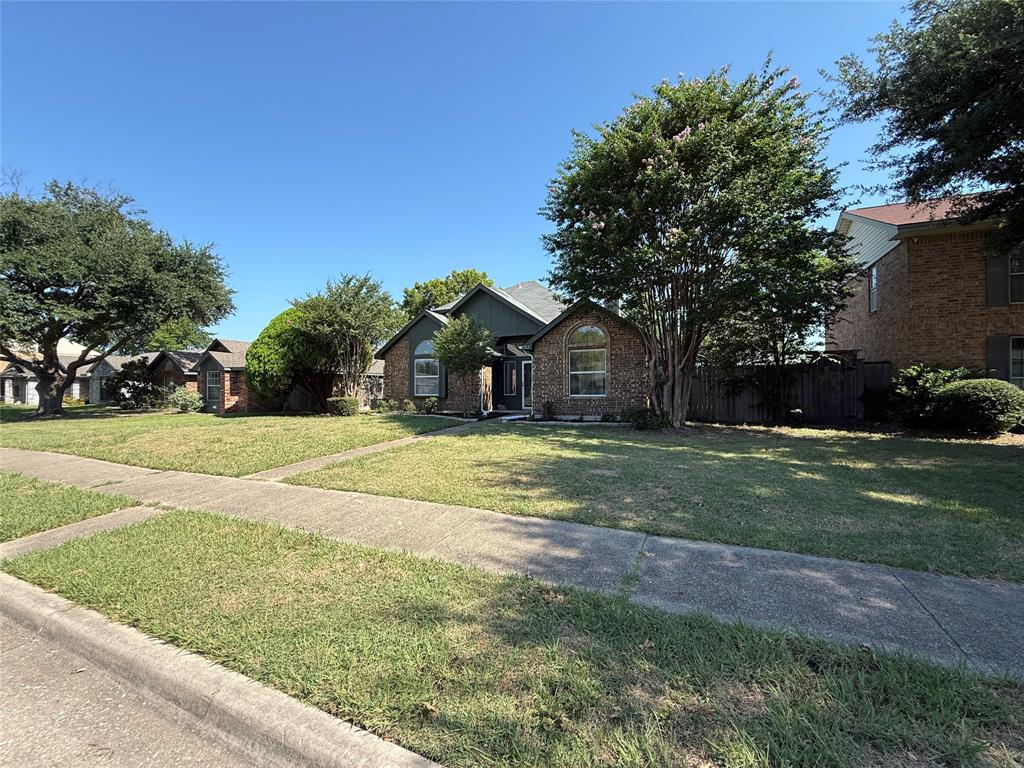 7913 Rice Drive Rowlett, TX 75088 - Photo 3 of 25 Brick exterior with arched window accents