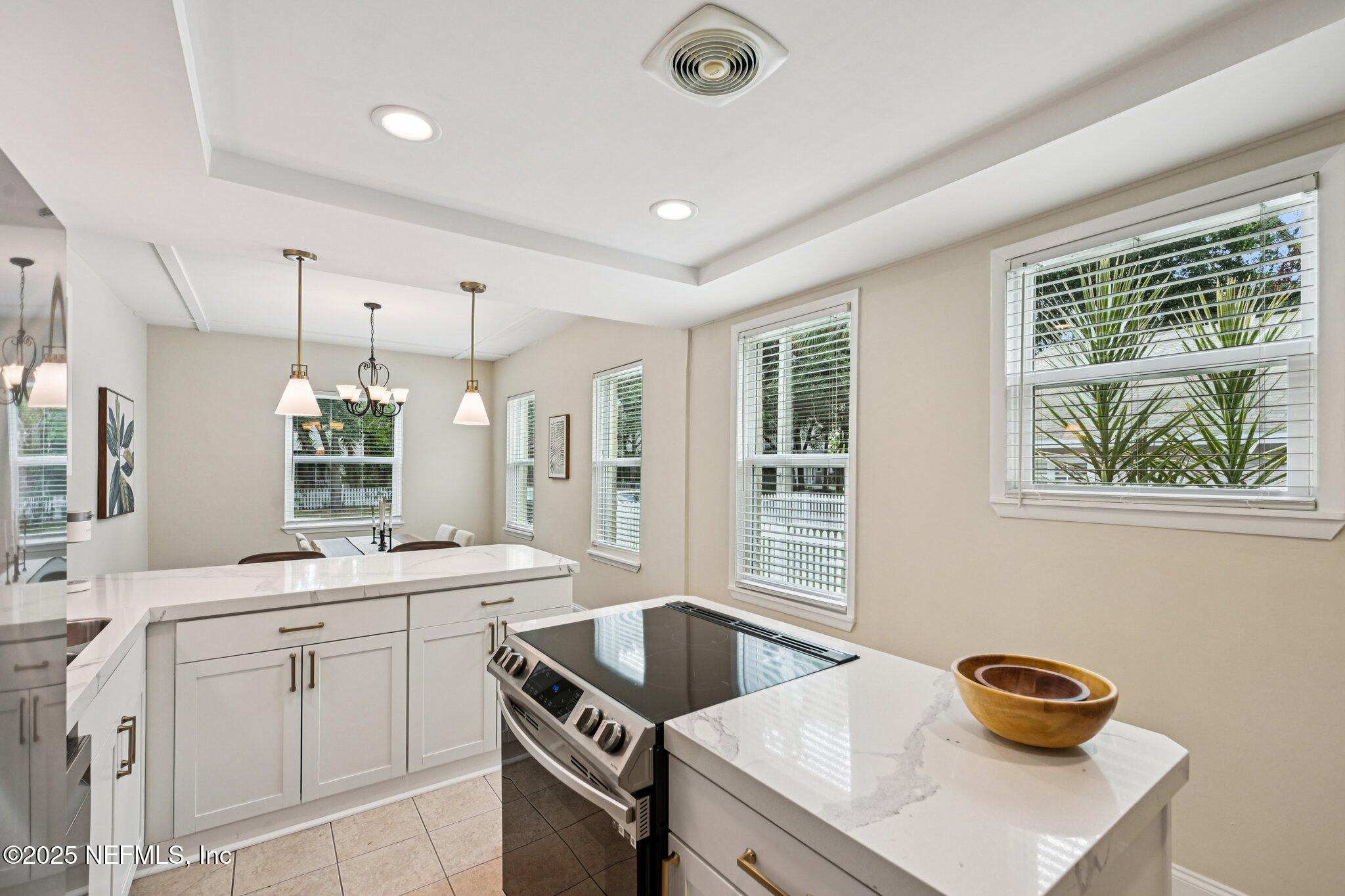 113 Seminole Road Atlantic Beach, FL 32233 - Photo 12 of 52 a kitchen with a sink stove and cabinets