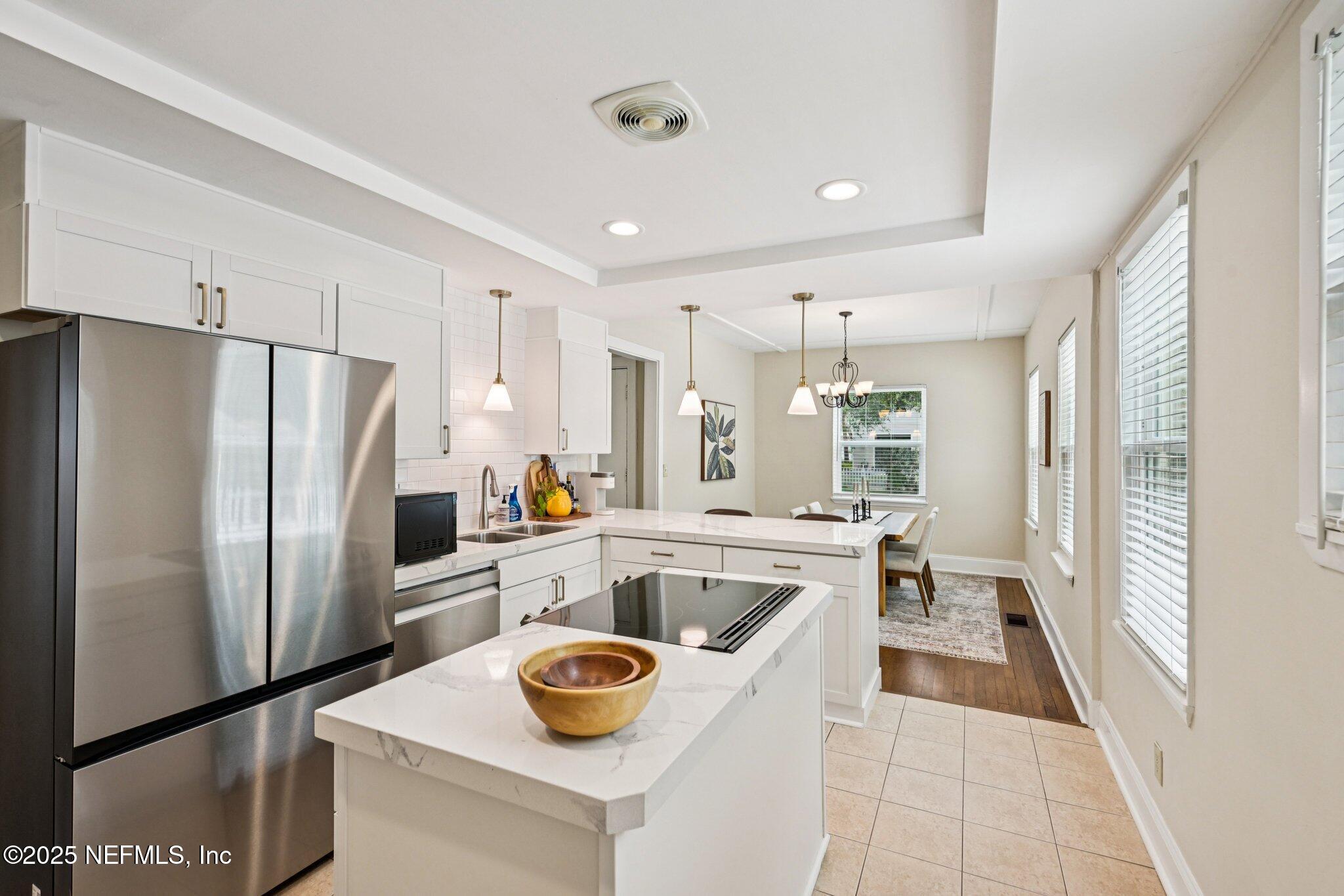 113 Seminole Road Atlantic Beach, FL 32233 - Photo 16 of 52 a kitchen with a refrigerator a stove and a sink