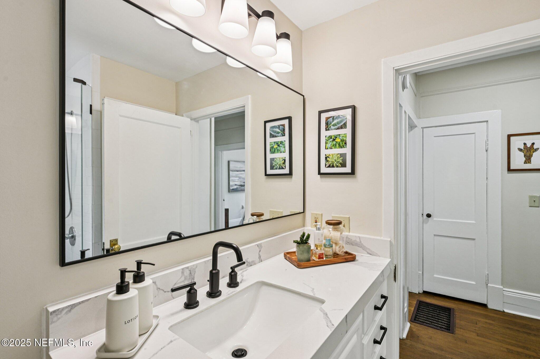 113 Seminole Road Atlantic Beach, FL 32233 - Photo 24 of 52 a bathroom with a sink and a mirror