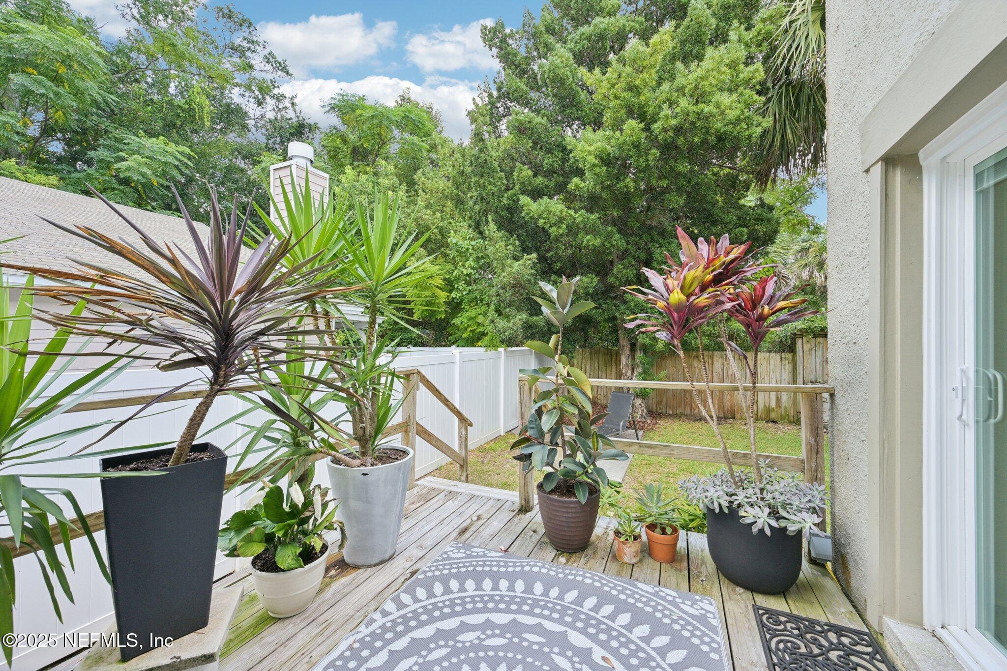 113 Seminole Road Atlantic Beach, FL 32233 - Photo 30 of 52 a view of a balcony with chairs and potted plants