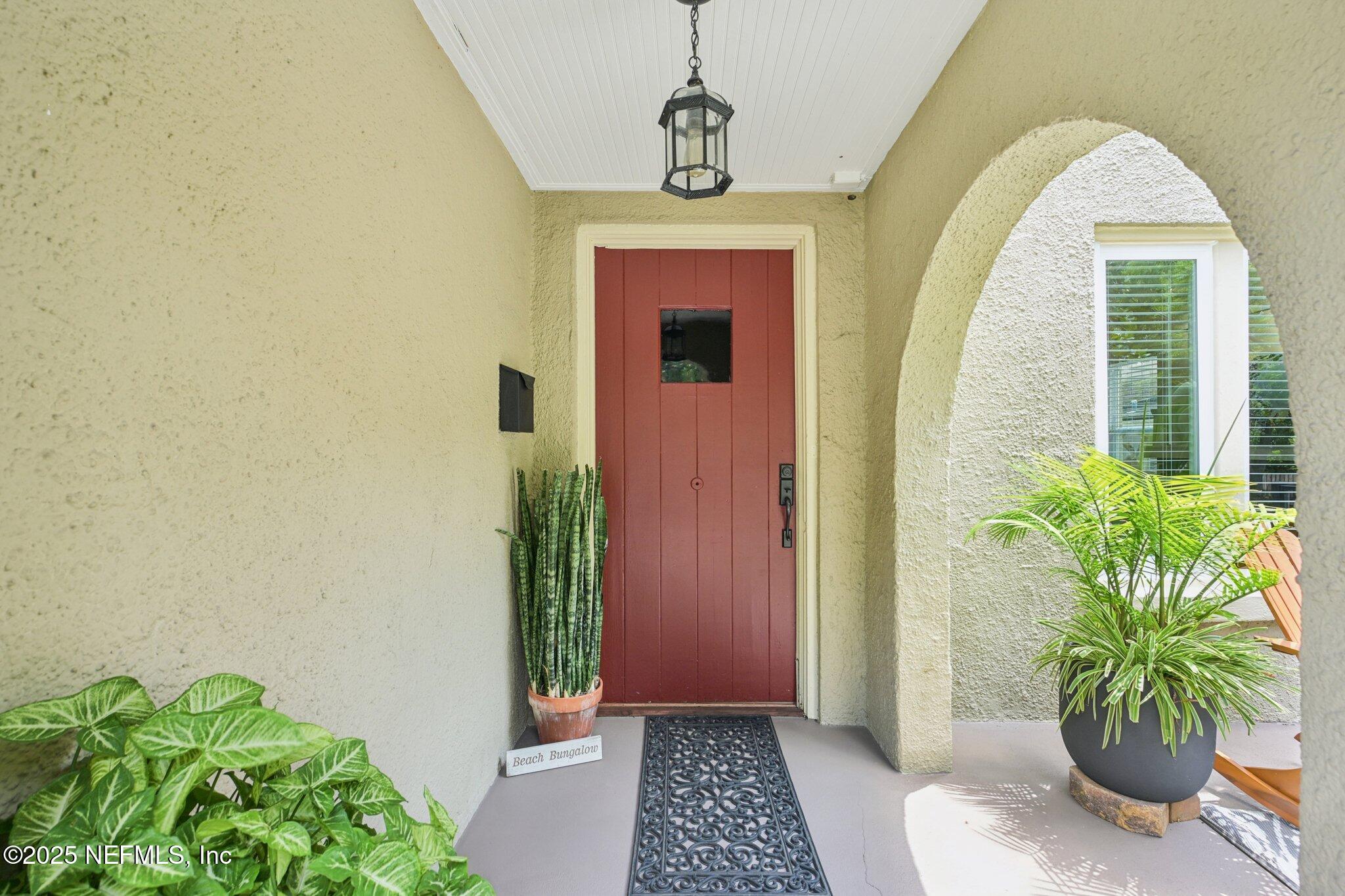 113 Seminole Road Atlantic Beach, FL 32233 - Photo 3 of 52 a front view of a house with a garden