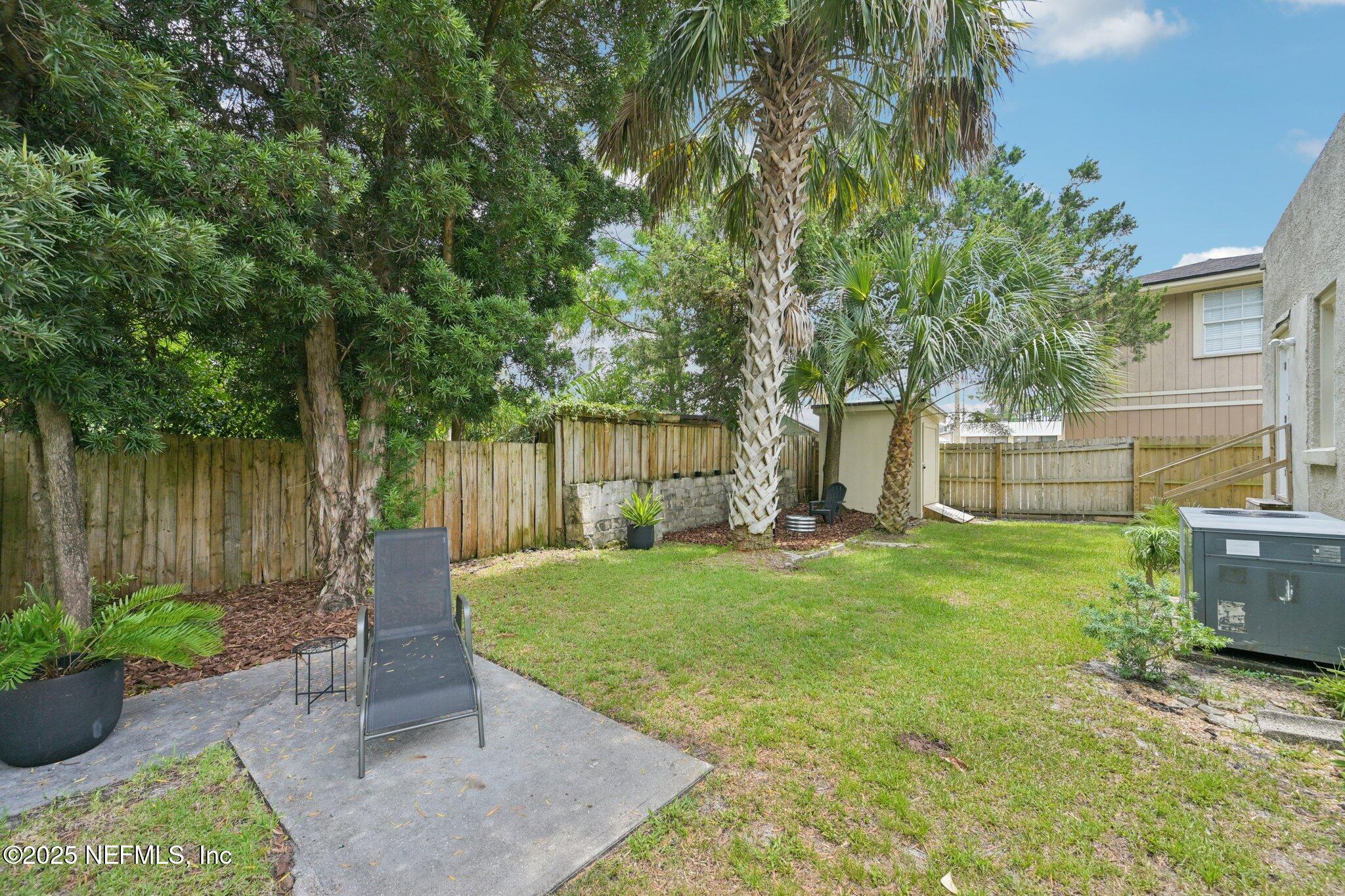 113 Seminole Road Atlantic Beach, FL 32233 - Photo 33 of 52 a view of a backyard with large trees and plants
