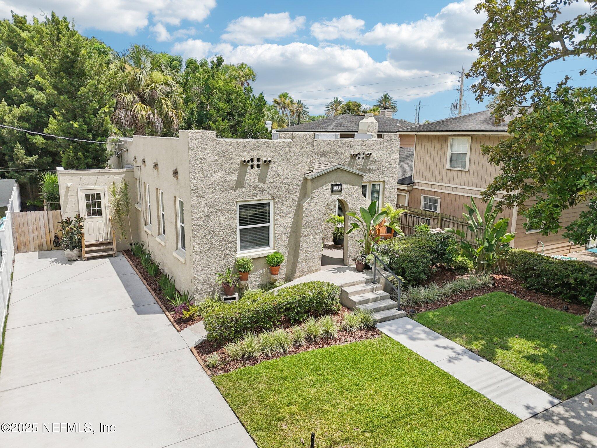 113 Seminole Road Atlantic Beach, FL 32233 - Photo 37 of 52 a view of a white house with a yard