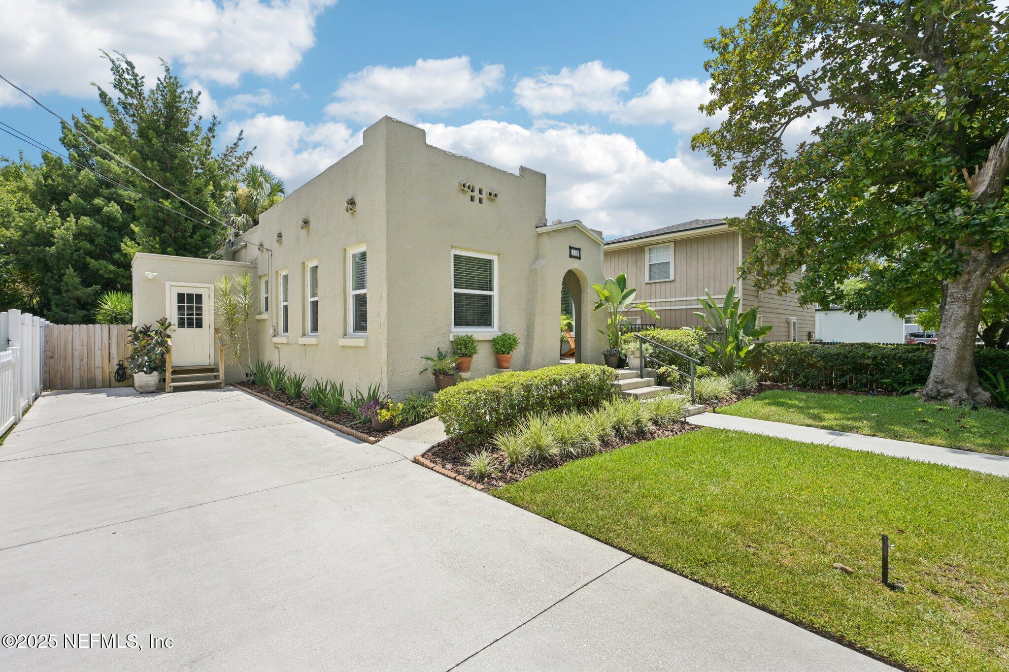 113 Seminole Road Atlantic Beach, FL 32233 - Photo 48 of 52 a front view of house with yard and green space