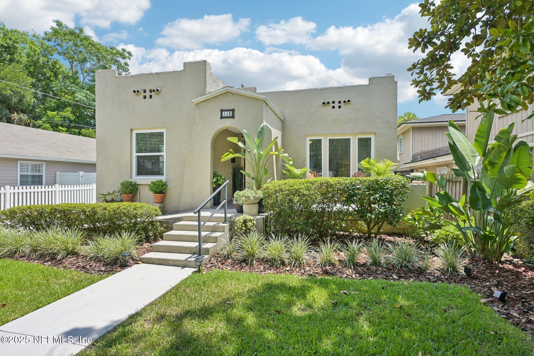113 Seminole Road Atlantic Beach, FL 32233 - Photo 50 of 52 a front view of a house with a yard